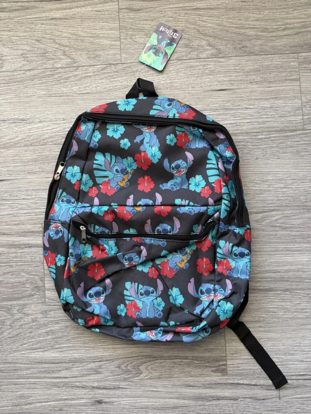 Disney Black Backpack with Blue Stitch and Red Floral Accents